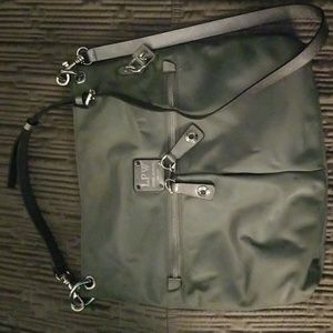 Henri Bendel messenger style bag in grey with silver zippers and strap